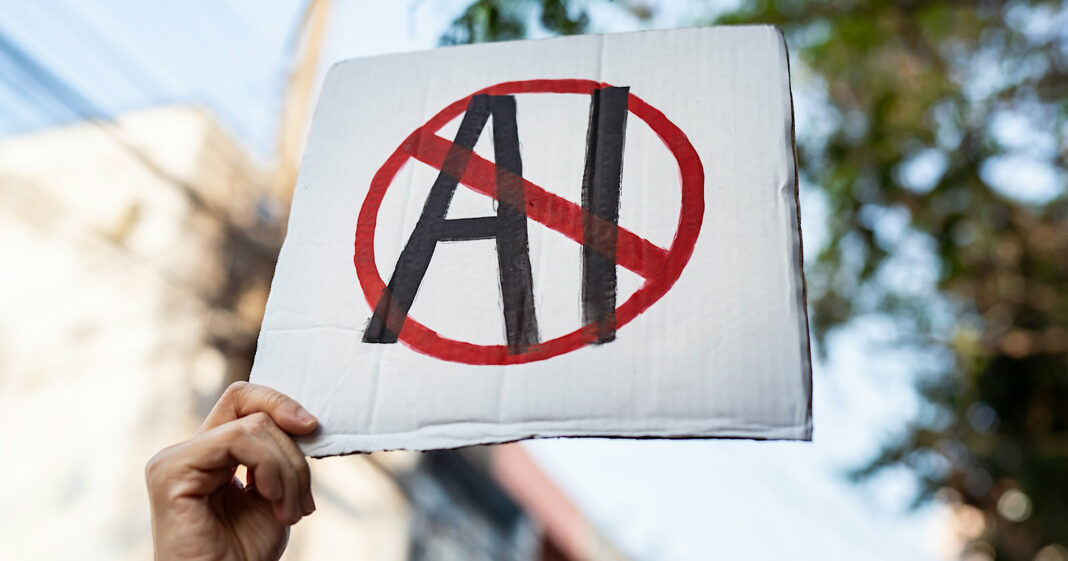 Demonstrator holding "No AI" placard